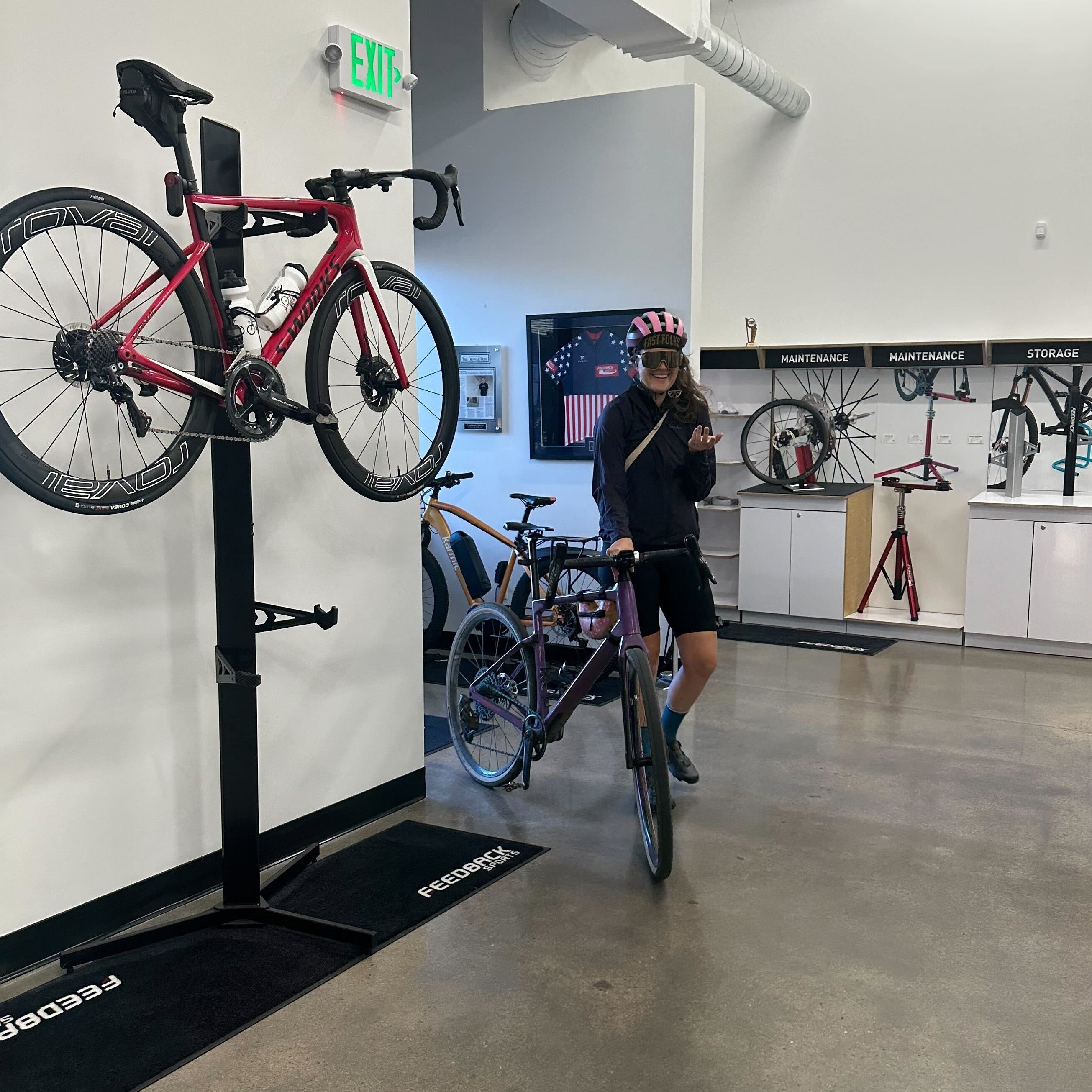 A person entering a sports-themed office after biking to work.
