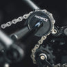 close up of a feedback sports thru axle chain keeper in use on a thru axle bike