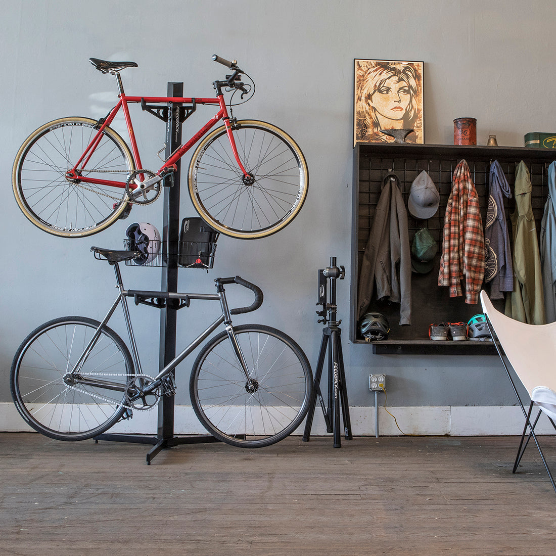 Vertical bike storage tower with 2 bikes in use in a small apartment.