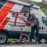 Professional bike mechanic working on road bike using Sprint bike repair stand.