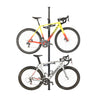 Feedback Sports Velo Column bike storage stand with two road bikes on white background.