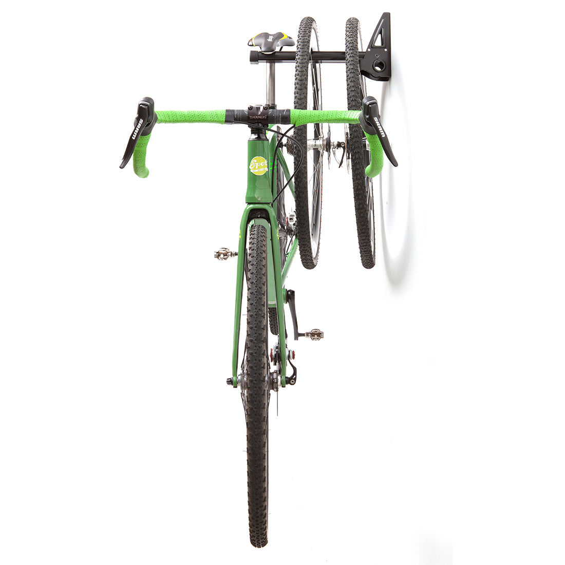 Green road bike viewed head on- suspended from Velo Wall post with wheels.