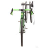 Green road bike viewed head on- suspended from Velo Wall post with wheels.