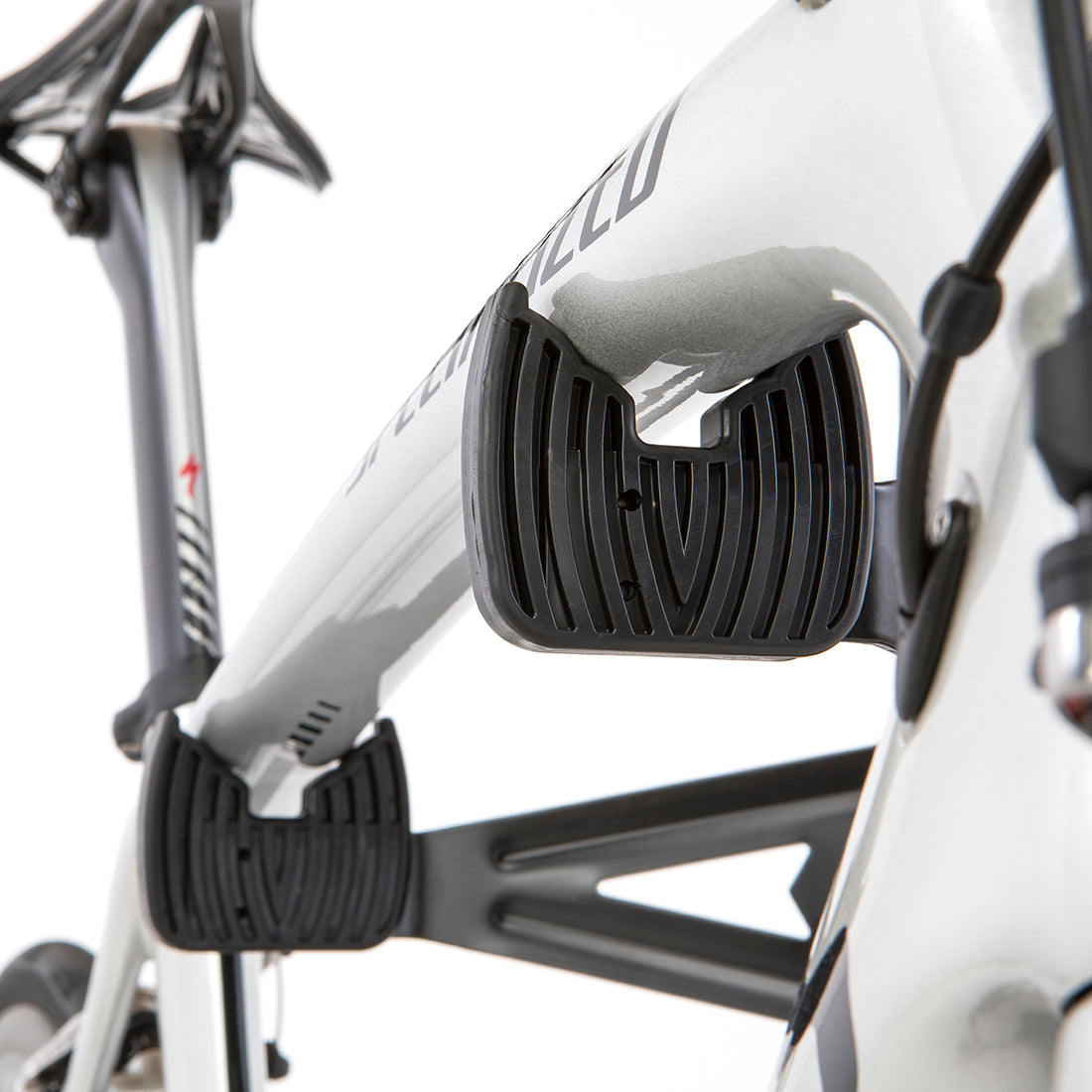 Close up of bike storage cradles with white bike installed.