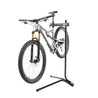 Feedback Sports Recreational bike repair stand with mountain bike mounted on white background.