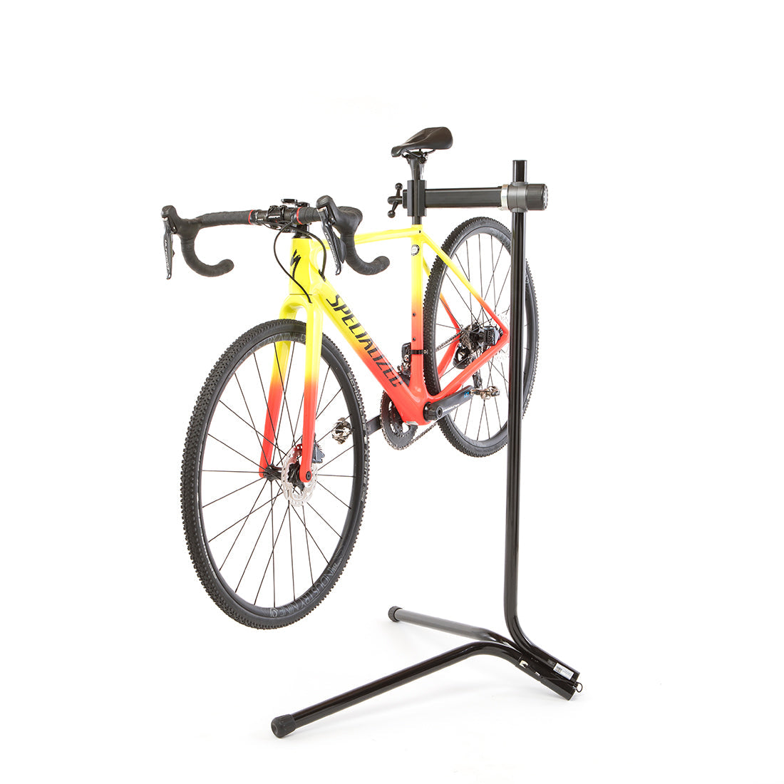 Feedback Sports Recreational bike repair stand with road bike mounted on white background.