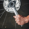 Bike disc brake lockring tool in use close up.