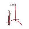 feedback pro mechanic bike repair stand open and set up next to a stand that is closed up and folded into it's most compact form for travel/storage etc