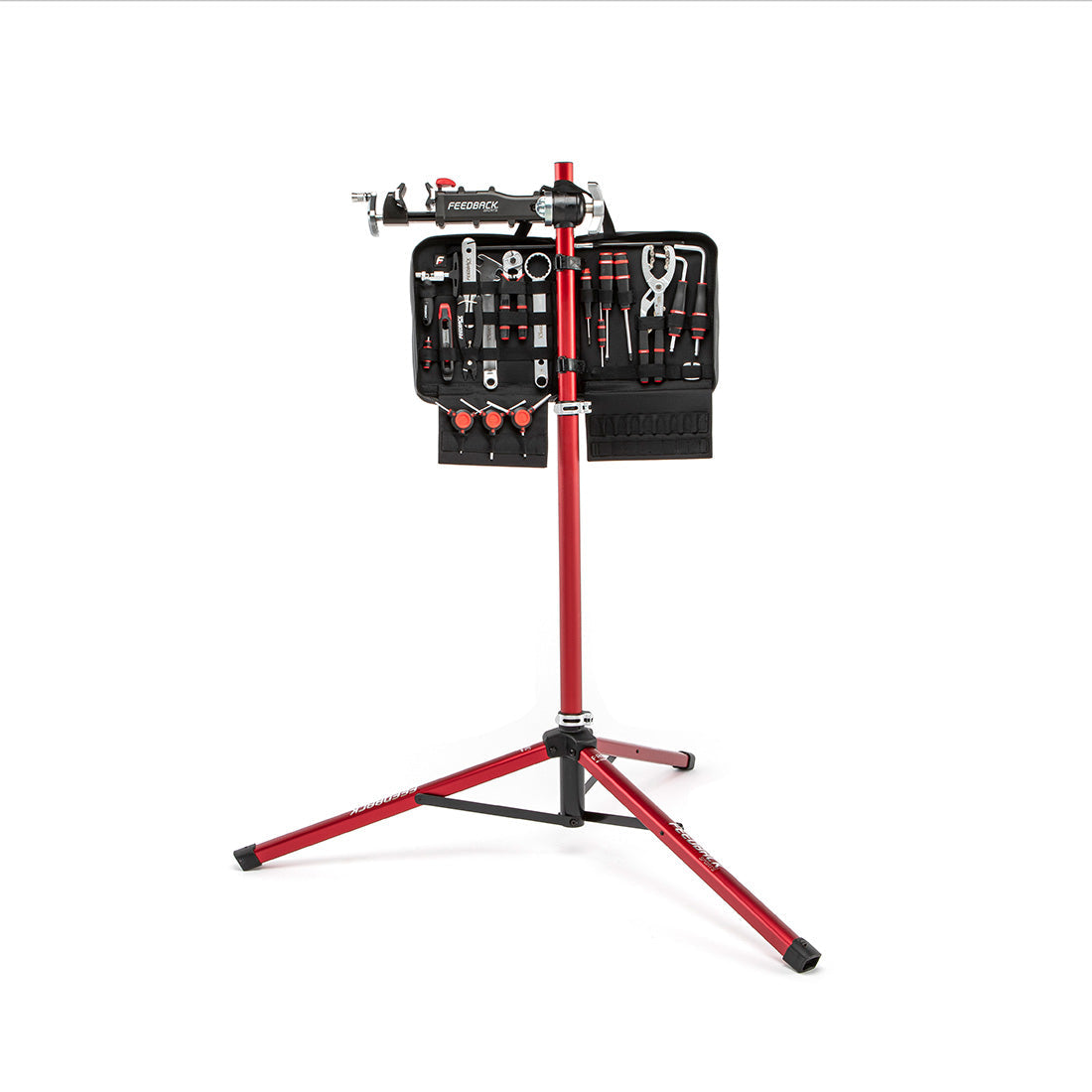 Feedback Sports Pro Mechanic bike repair stand deployed for use with tool kit on white background.